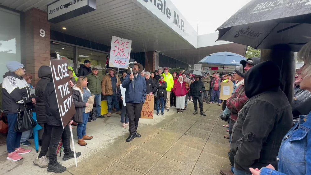 Axe the Tax! chant protestors outside Jordan Crugnales' office post image