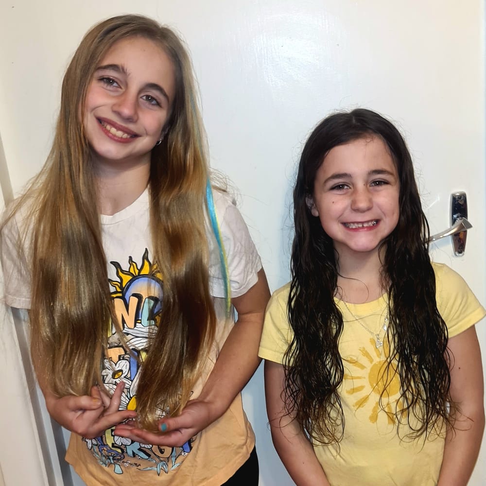 Sisters donate hair in memory of grandmother for cancer fundraiser post image
