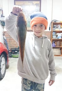 Young angler shows how its done with a prize catch post image